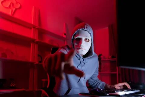 This is the face of a hacker who is knowledgeable with operating systems a... Stock Photos