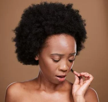 Face, hair and split ends with a model black woman in studio on a brown Stock Photos