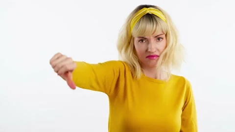 Face, hand and thumbs down by woman for negative Stock Footage 236652763