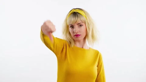 Face, hand and thumbs down by woman for negative Stock Footage 240334475