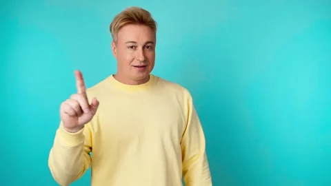 Face, hand and thumbs down by man for negative, feedback or review, finger emoji 動画素材 246555899