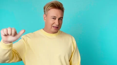 Face, hand and thumbs down by man for negative, feedback or review, finger emoji Stock Footage 255657577