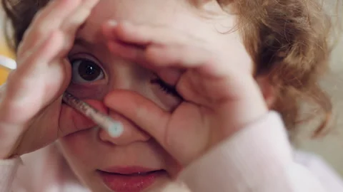Face, hands and child with hide in home for peeking game, curious imagination Stock Footage 335912580