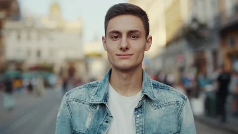 Face handsome young man look at camera smiling at old city street. Feel happy at Stock Footage 146758591