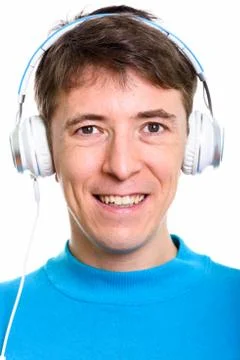 Face of happy man smiling while listening to music Foto stock