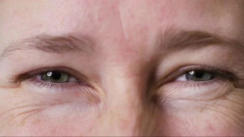 Face of happy middle aged Millennial woman smiling at camera with blue eyes. Stock Footage 165950306