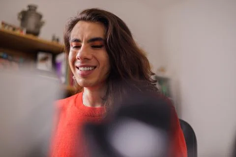 Face of happy non-binary person doing their job Stock Photos