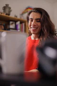 Face of happy non-binary person doing their job Stock Photos
