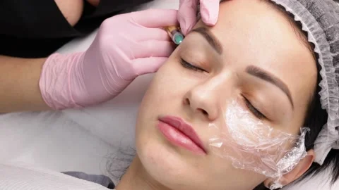 Face Injection. Anti Aging Biorevitalization In Cosmetic Salon.Young Girl Is Stock Footage