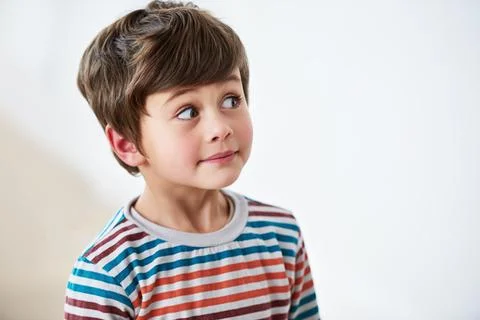 Face, kid and boy thinking, idea and remember memory isolated on a white studio 写真素材