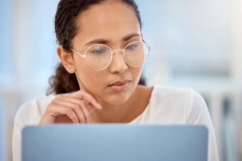 Face, laptop and problem solving with freelance woman in home office for Foto stock