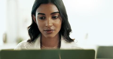 Face, laptop and remote work with Indian woman in home office for information Stock Photos