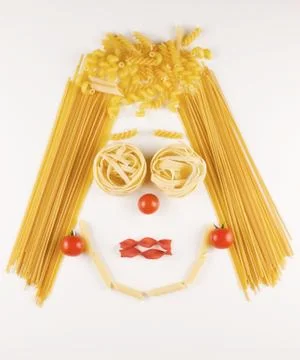 Face made with different kind of raw pasta Stock Photos