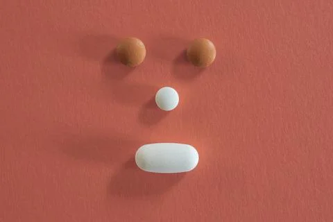 Face made with different pills Stock Photos