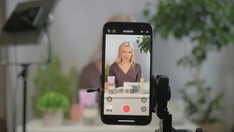 Face, makeup influencer or vlog with girl, spray or advice with content creator Stock Footage 320248020
