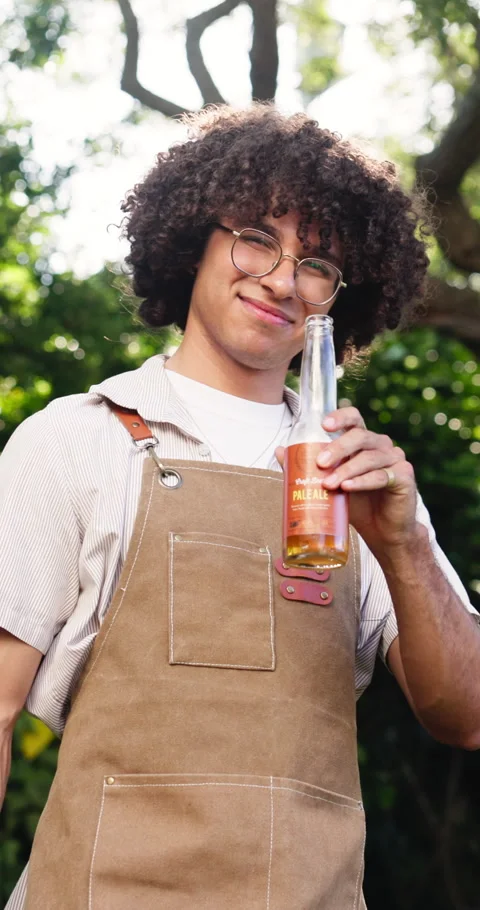 Face, man and bbq with beer in backyard for cooking lunch, celebration cheers or Stock Footage 331348699