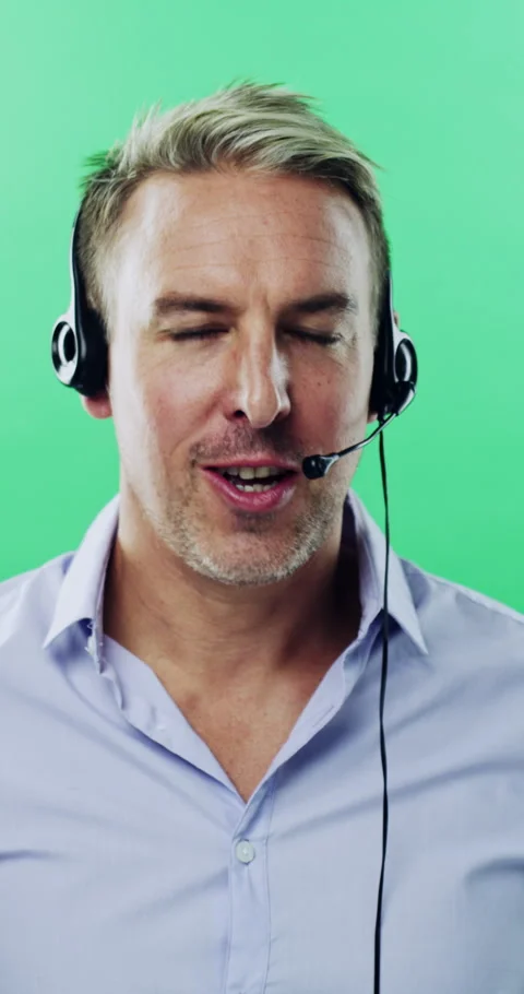 Face, man and call center agent in studio for help, technical support and Stock Footage 334907101