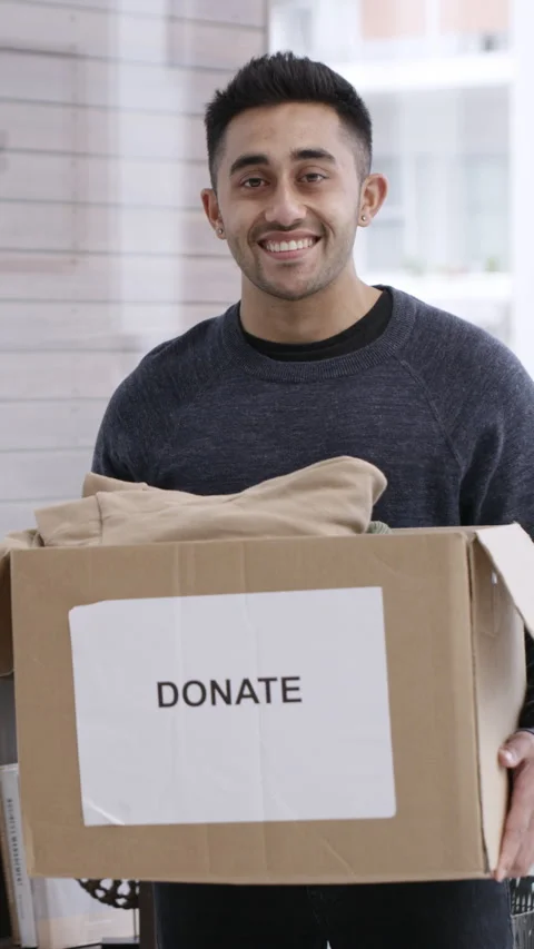 Face, man and clothes in donation box in home for non profit, portrait and Stock-Footage 324015738