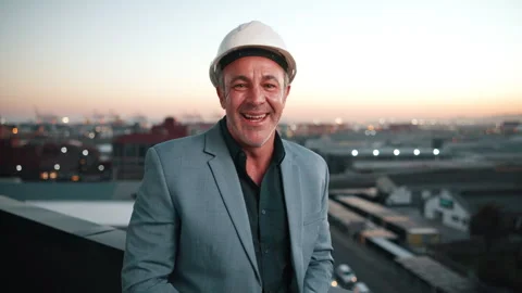 Face, man and engineer on balcony with smile, inspection and architecture for Stock Footage 338024305