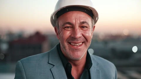 Face, man and engineer in city with smile, inspection and architecture for Stock Footage 338021171