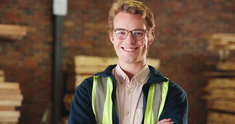 Face, man and happy with arms crossed in carpentry for joinery expertise, Stock Footage 341404484