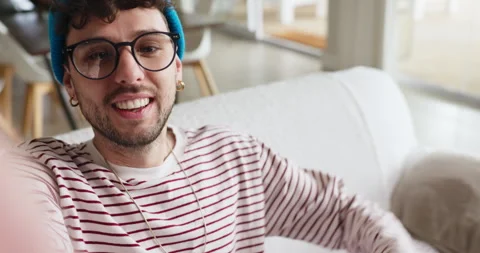 Face, man and live streaming with wave in home for living room tour, online Stock Footage 318736038