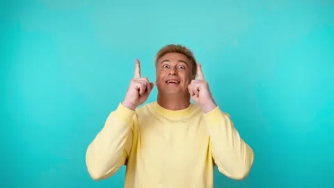 Face, man and pointing to mockup, advertising, branding in studio isolated on bl Stock Footage 244913326