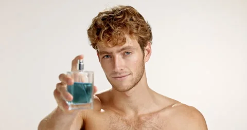 Face, man and spray perfume for hygiene, grooming and fragrance on white studio Stock-Footage 312406532