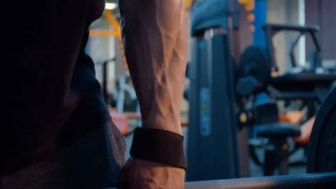 Face of a man doing exercises with the big barbell 스톡 동영상 112545105