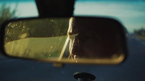 Face man drive the car look at mirror face vehicle automobile hand male work Stock Footage 116998519