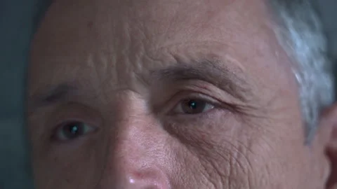 The face of a man falling asleep watching TV Stock Footage 249436426