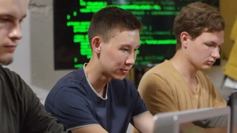 Face of Man Typing Codes on Laptop Stock Footage 99470798