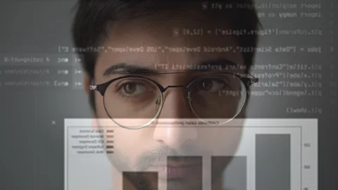 The face of a man working on the computer with the code Stock Footage 129442415