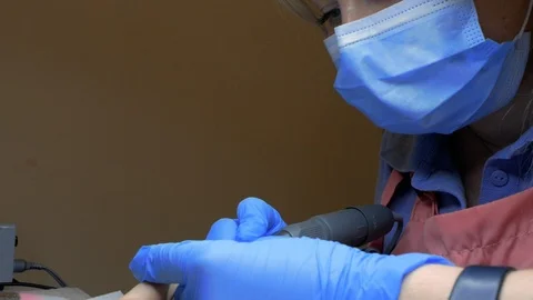 Face of manicurist doing hardware manicure for a woman in a beauty salon Stock Footage 114314582