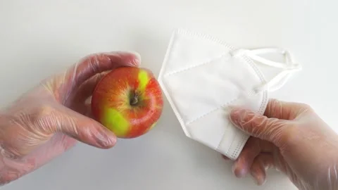 Face mask and apple Stock Footage 151680547
