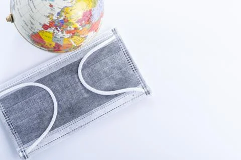 Face mask and Globe model Stock Photos