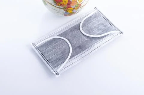 Face mask and Globe model Stock Photos