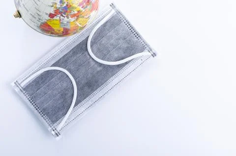 Face mask and Globe model Stock Photos