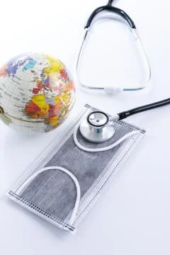Face mask and Globe model Stock Photos