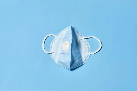 Face mask on blue Stock Photos