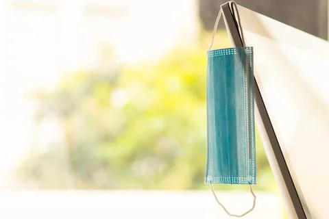 Face mask on computer screen in office for coronavirus pandemic 스톡 사진