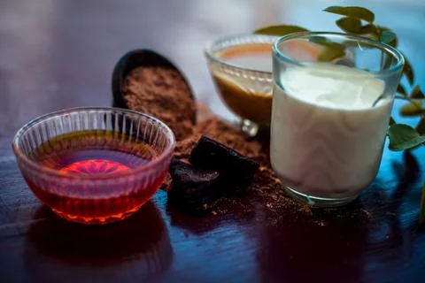Face mask of devil's dung powder on wooden surface i.e. Hing powder well mixe Stock Photos