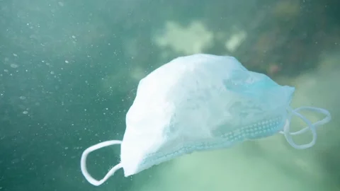 Face Mask discarded in ocean plastic pollution 4K Video stock 158087959