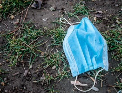 Face mask on the ground Foto stock