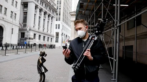 Face Mask Man Holding Camera Shaking Head At Smartphone Empty Wall Street Stock Footage 128704540