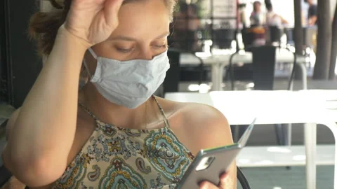 Face Mask Protected Girl Using Smartphone Stock Footage 135020096