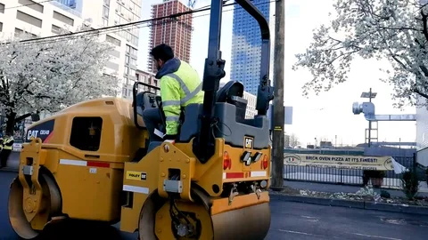 Face Masked Cat Asphalt Paving Men Joking Around Jersey City Roads Stock Footage 128337780