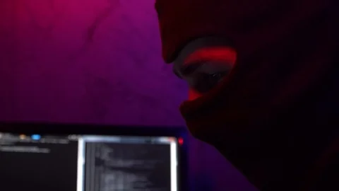 Face Masked at Computer. Black Mask. Man Hacks System Stock Footage 124360795
