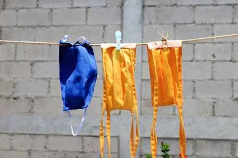 Face masks drying at the sun Foto stock