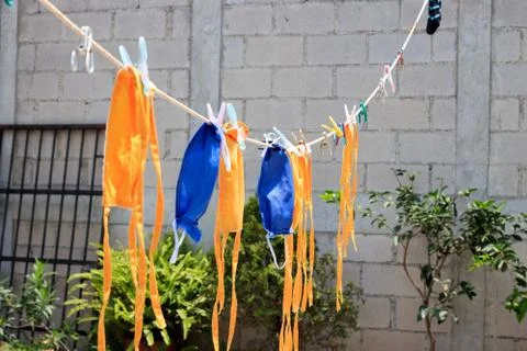 Face masks drying at the sun Foto stock